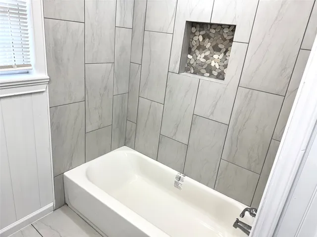 a bathroom with a white sink and vanity