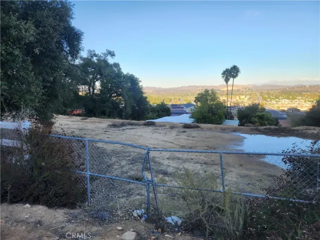 a view of a yard and mountain view