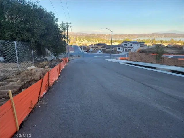 a view of a street with an ocean view
