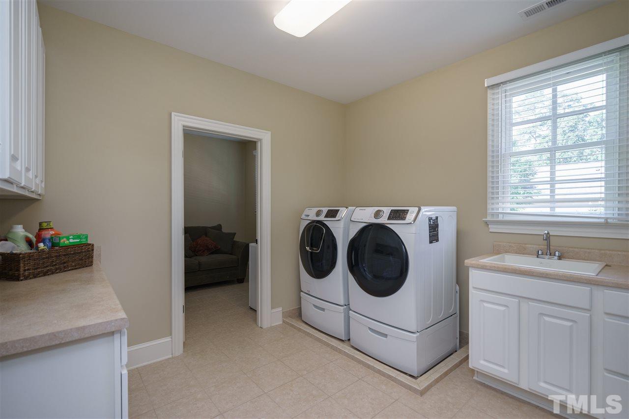 3029 Farrior Road Raleigh, NC 27607 - Photo 20 of 25 ...continues the theme of spaciousness that is found throughout the house. There is also a small craft/sewing room adjacent to the Laundry Room.