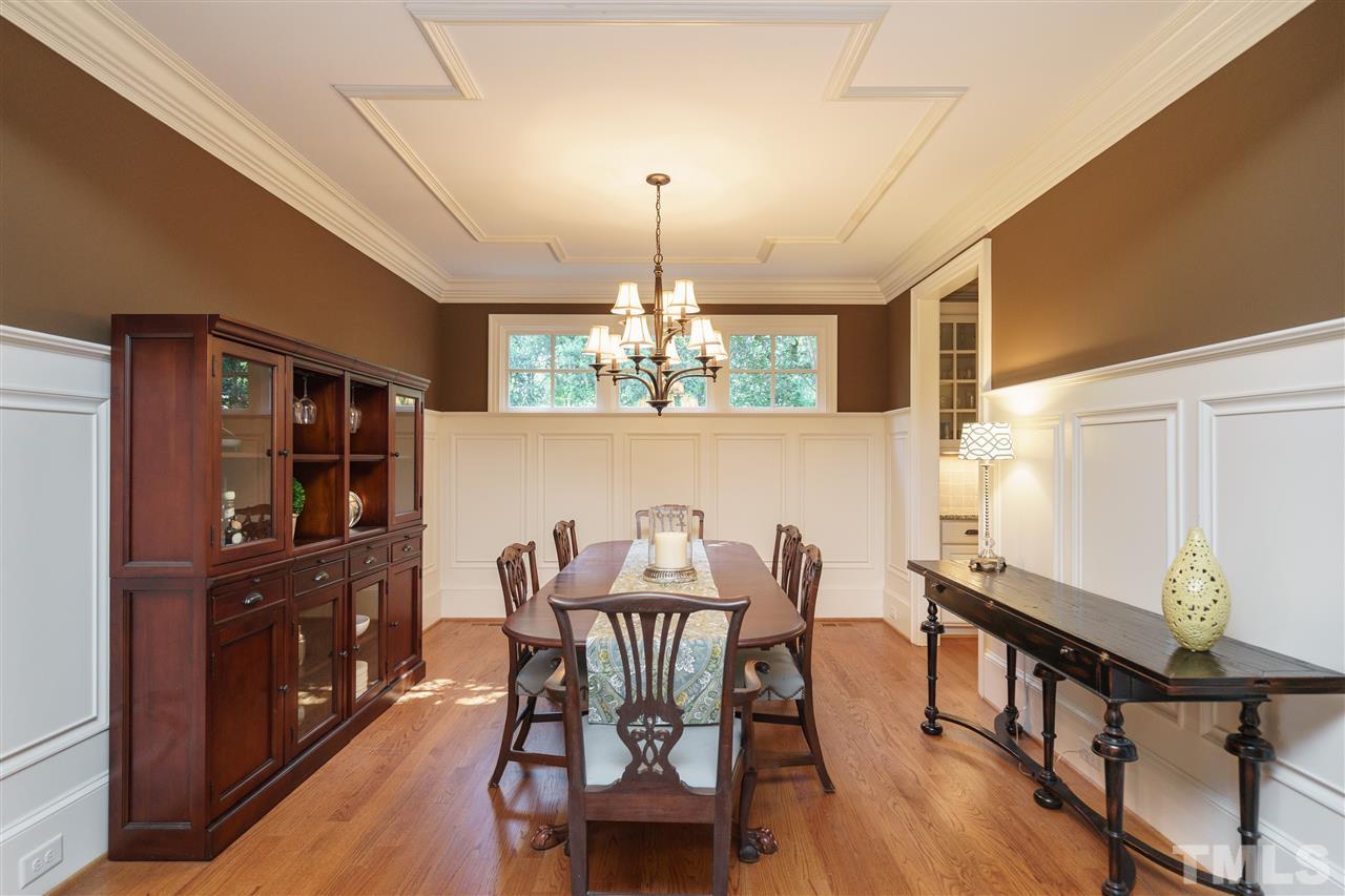 3029 Farrior Road Raleigh, NC 27607 - Photo 9 of 25 ...is a showplace for the incredible moldings and trim that are found throughout the house. Picture frame trim on the ceiling, extra wide baseboards, high wainscoting with inset trim, and a transom-style window that leaves room for a sideboard below it.
