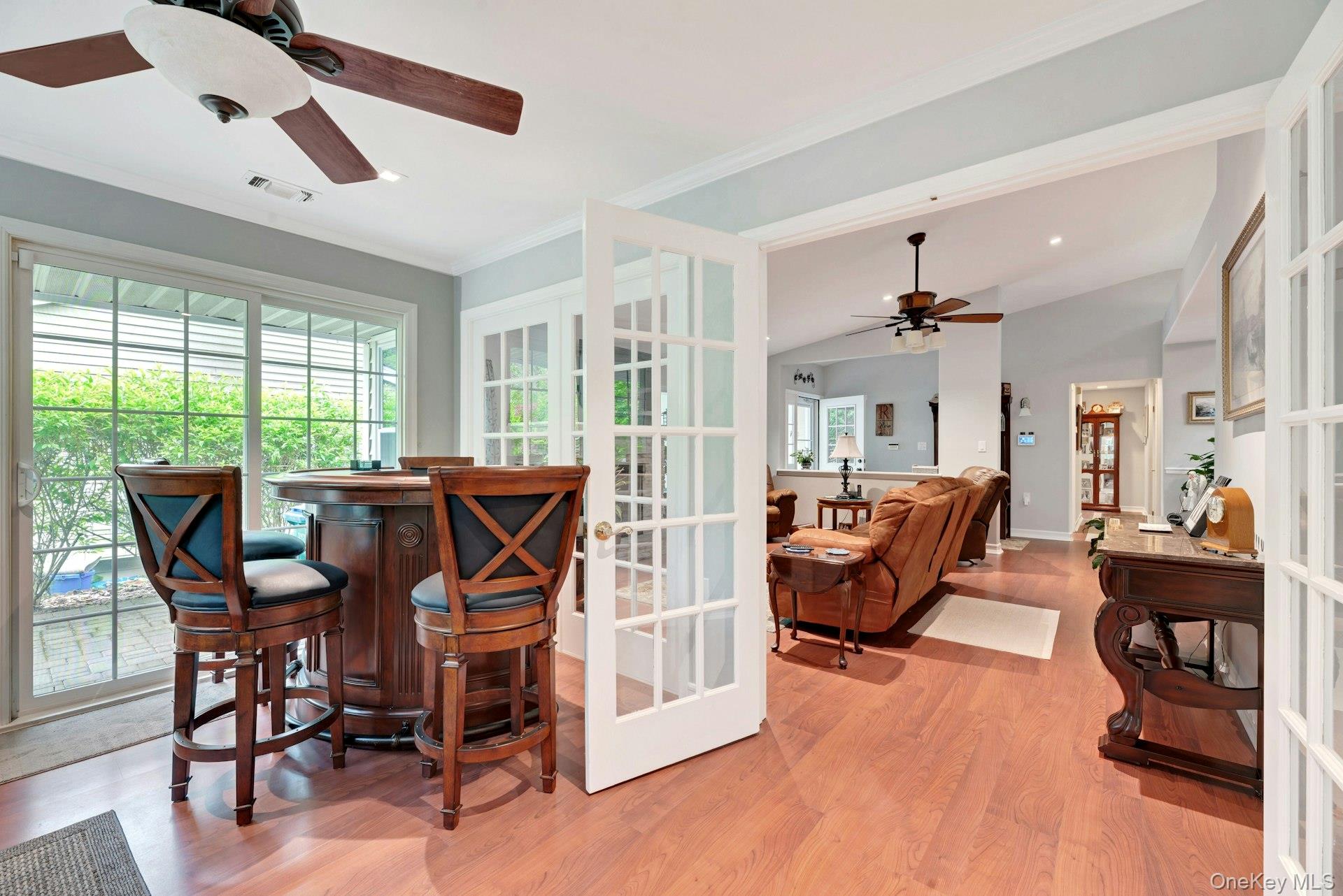104 Glen Drive Ridge, NY 11961 - Photo 9 of 25 a view of a dining room with furniture and wooden floor