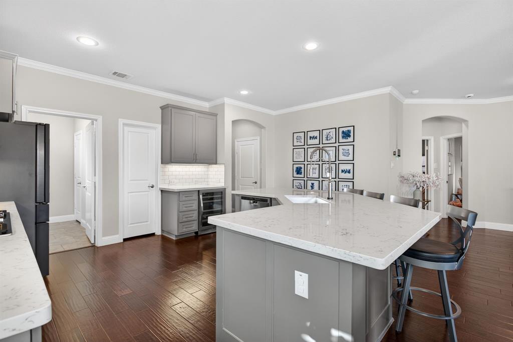 5213 Scott Road Fort Worth, TX 76114 - Photo 12 of 35 a large kitchen with a table chairs refrigerator and a table