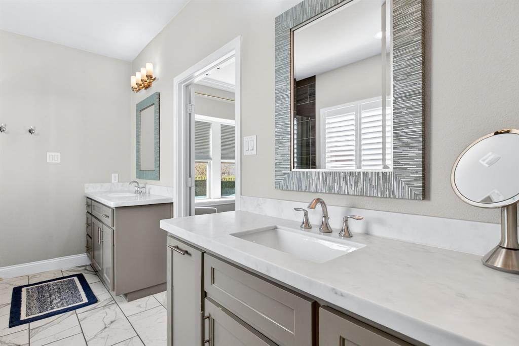5213 Scott Road Fort Worth, TX 76114 - Photo 18 of 35 a bathroom with a sink and a mirror