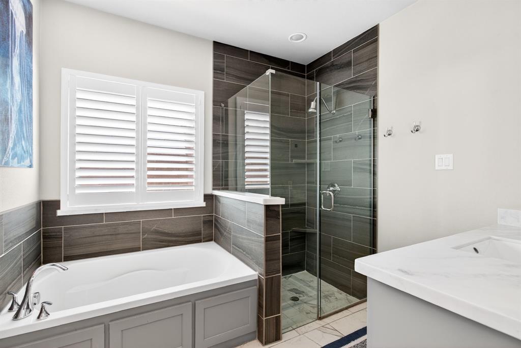 5213 Scott Road Fort Worth, TX 76114 - Photo 19 of 35 a bathroom with a tub sink and shower