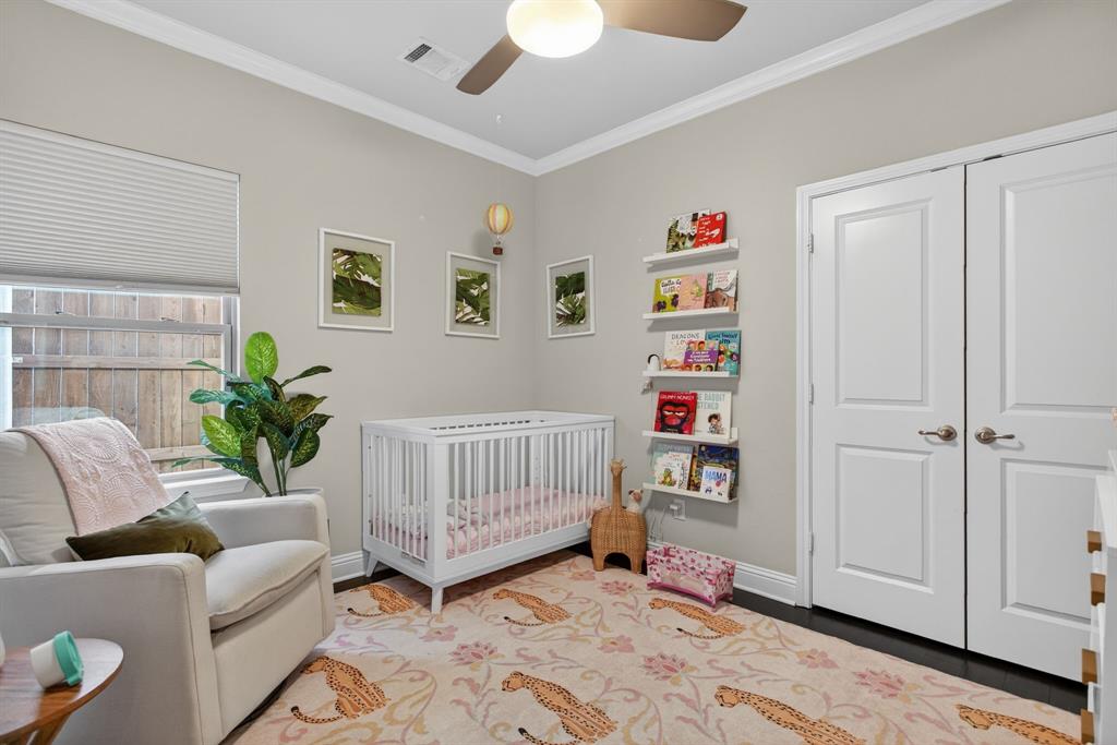 5213 Scott Road Fort Worth, TX 76114 - Photo 21 of 35 a bedroom with furniture and a book shelf