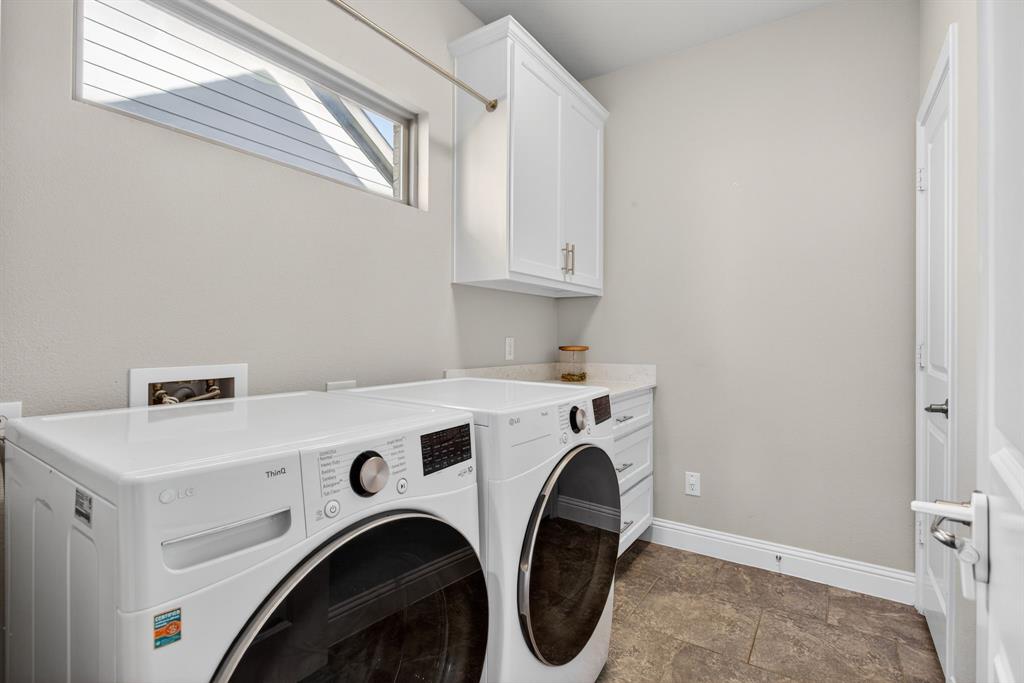 5213 Scott Road Fort Worth, TX 76114 - Photo 25 of 35 a utility room with dryer and washer