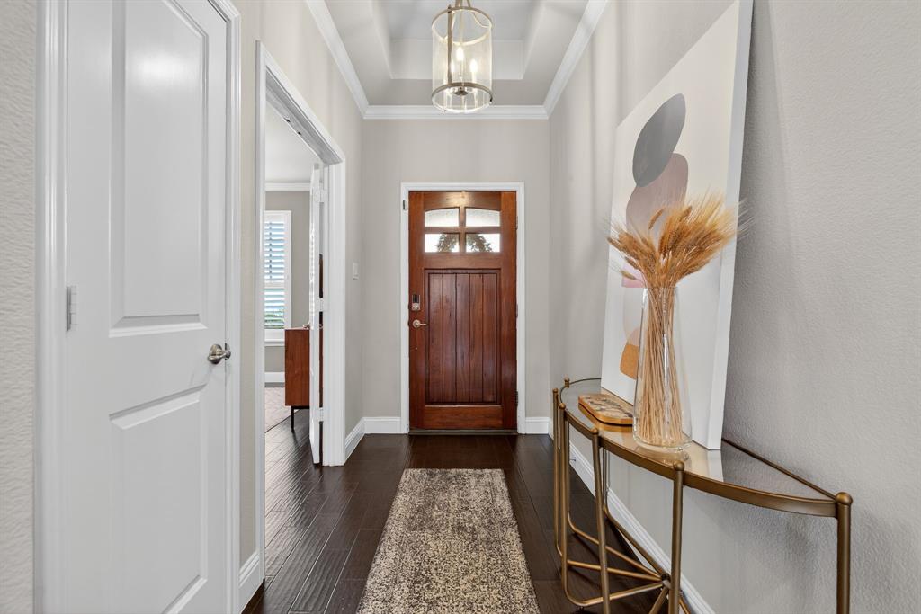 5213 Scott Road Fort Worth, TX 76114 - Photo 3 of 35 a view of a hallway with wooden floor and staircase