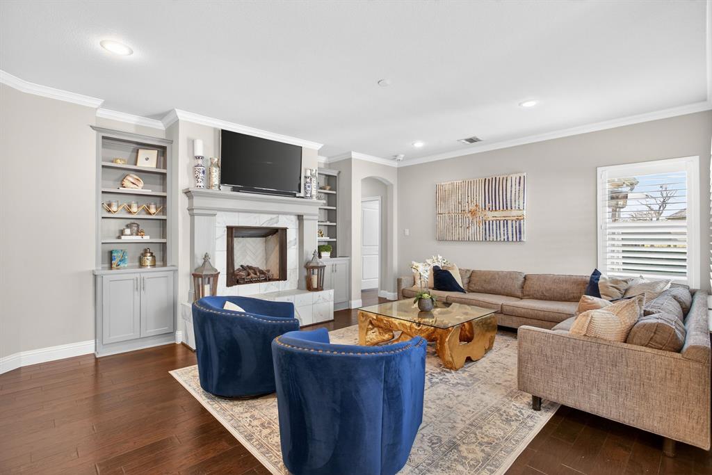 5213 Scott Road Fort Worth, TX 76114 - Photo 5 of 35 a living room with furniture a flat screen tv and a fireplace