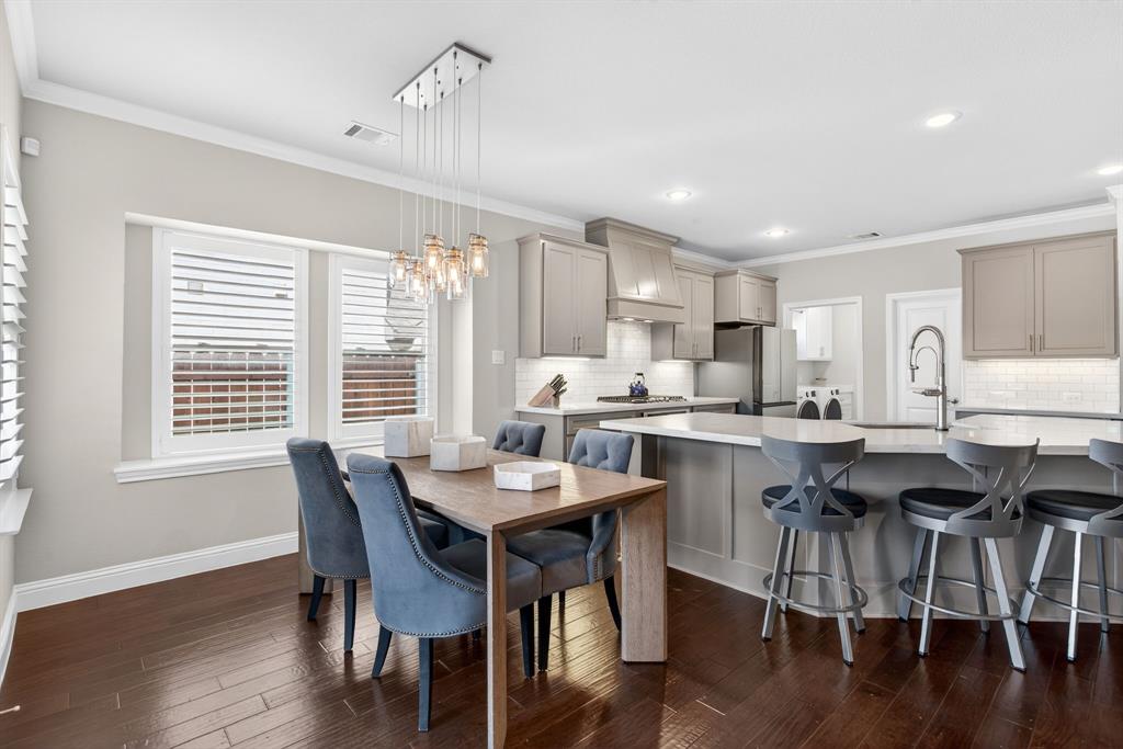 5213 Scott Road Fort Worth, TX 76114 - Photo 9 of 35 a kitchen with a table and chairs in it