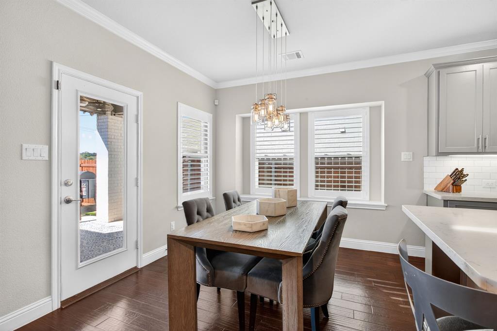 5213 Scott Road Fort Worth, TX 76114 - Photo 10 of 35 a view of a dining room with furniture and wooden floor
