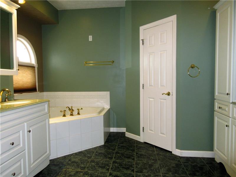 185 Mesa Drive Freeport, PA 16229 - Photo 12 of 25 Very nicely sized master bath has everything you need including a heart shaped jet tub with ceramic tile, a large stand up shower with 3 shower heads, his and her sinks and cabinets, a linen closet and a 7' x 6' walk in closet!
