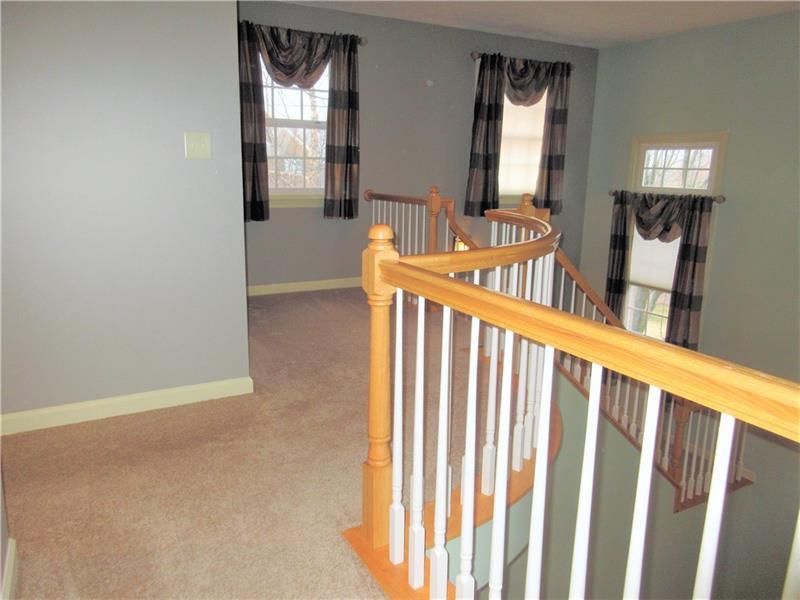 185 Mesa Drive Freeport, PA 16229 - Photo 17 of 25 The second floor hall offers lots of natural light and a balcony overlooking the living room.