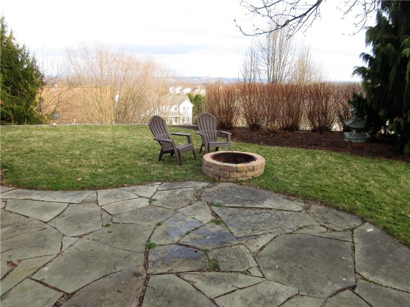 185 Mesa Drive Freeport, PA 16229 - Photo 23 of 25 Uncovered patio and fire pit in the backyard, with a great view!