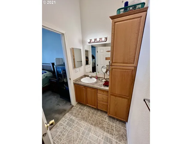 a bathroom with a sink and mirror