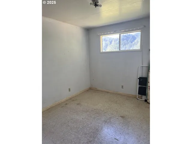 a view of an empty room with windows