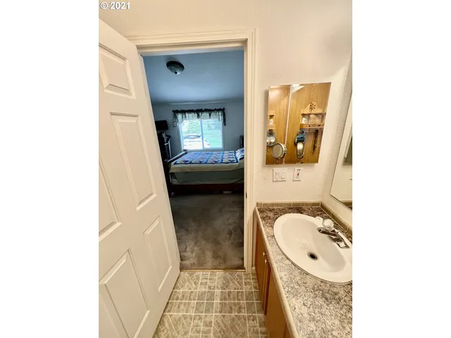 a bathroom with a sink and mirror