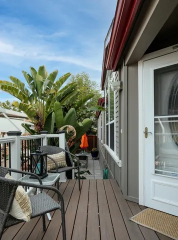 a view of balcony with furniture