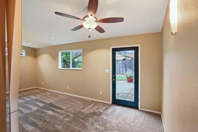 a view of a backyard with sitting area