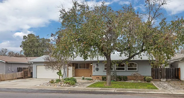 front view of a house with a garden