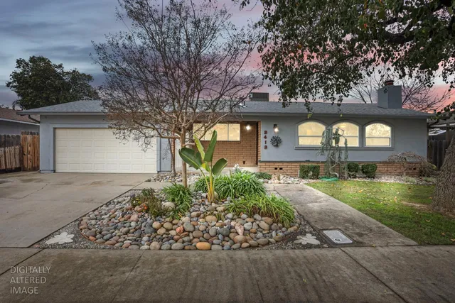 a view of a porch with a table and chairs and potted plants