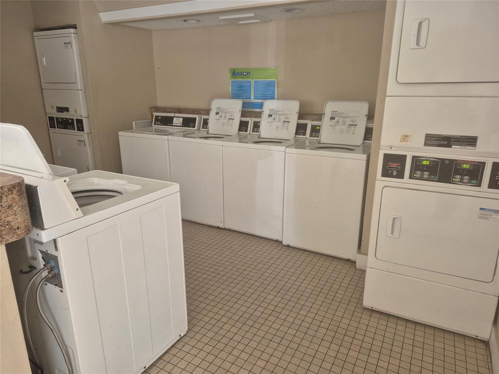 4481 West McNab Road, Unit 10 Pompano Beach, FL 33069 - Photo 14 of 16 a utility room with dryer and washer