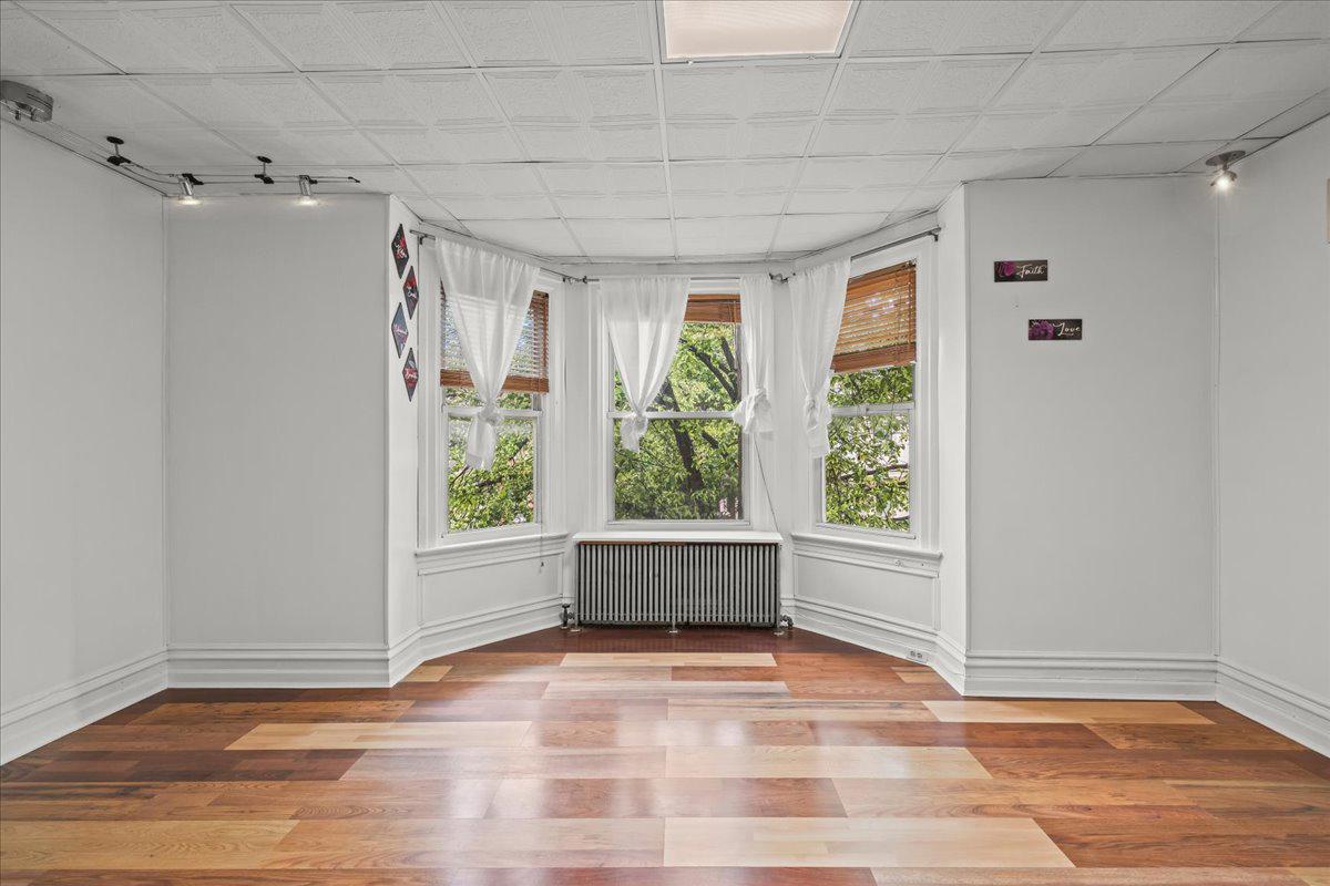 609 East Chestnut Street Lancaster, PA 17602 - Photo 20 of 24 Bedroom 3 Bright, airy space with bay windows.