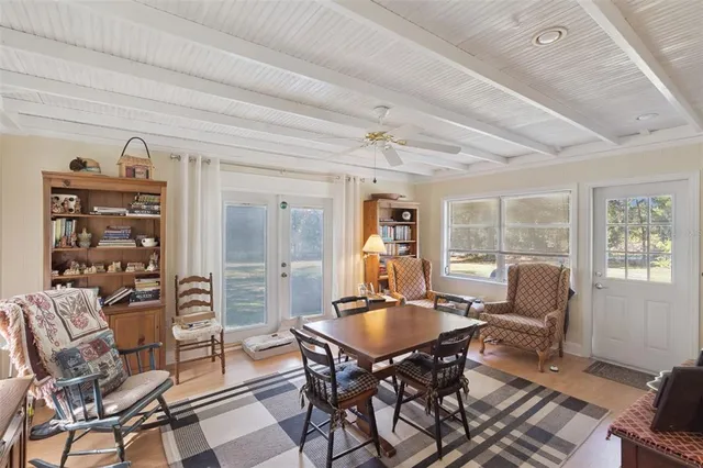 a dining room with furniture and window