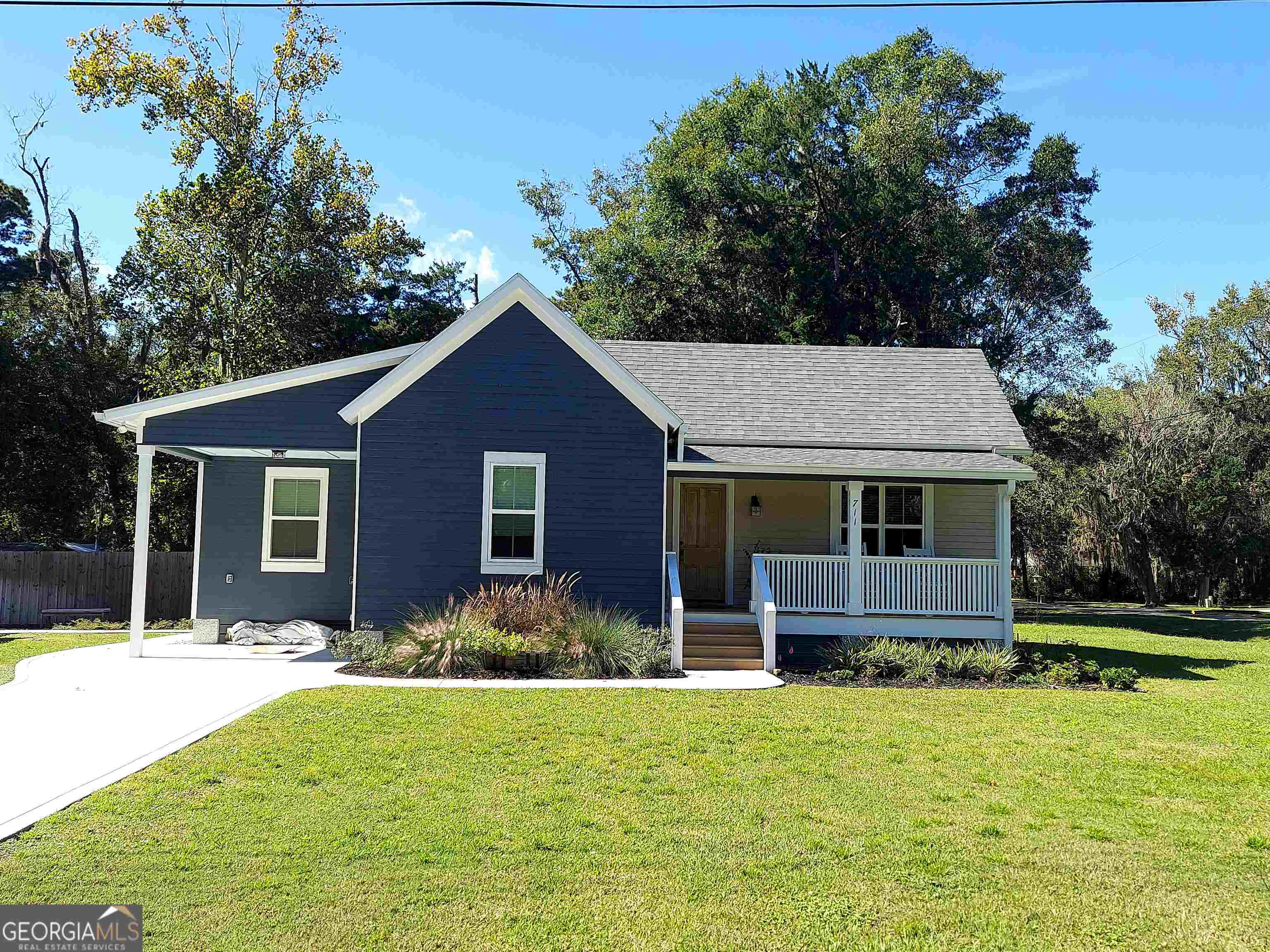 711 Wheeler Street St. Marys, GA 31558 - Photo 1 of 1 a front view of house with yard and green space
