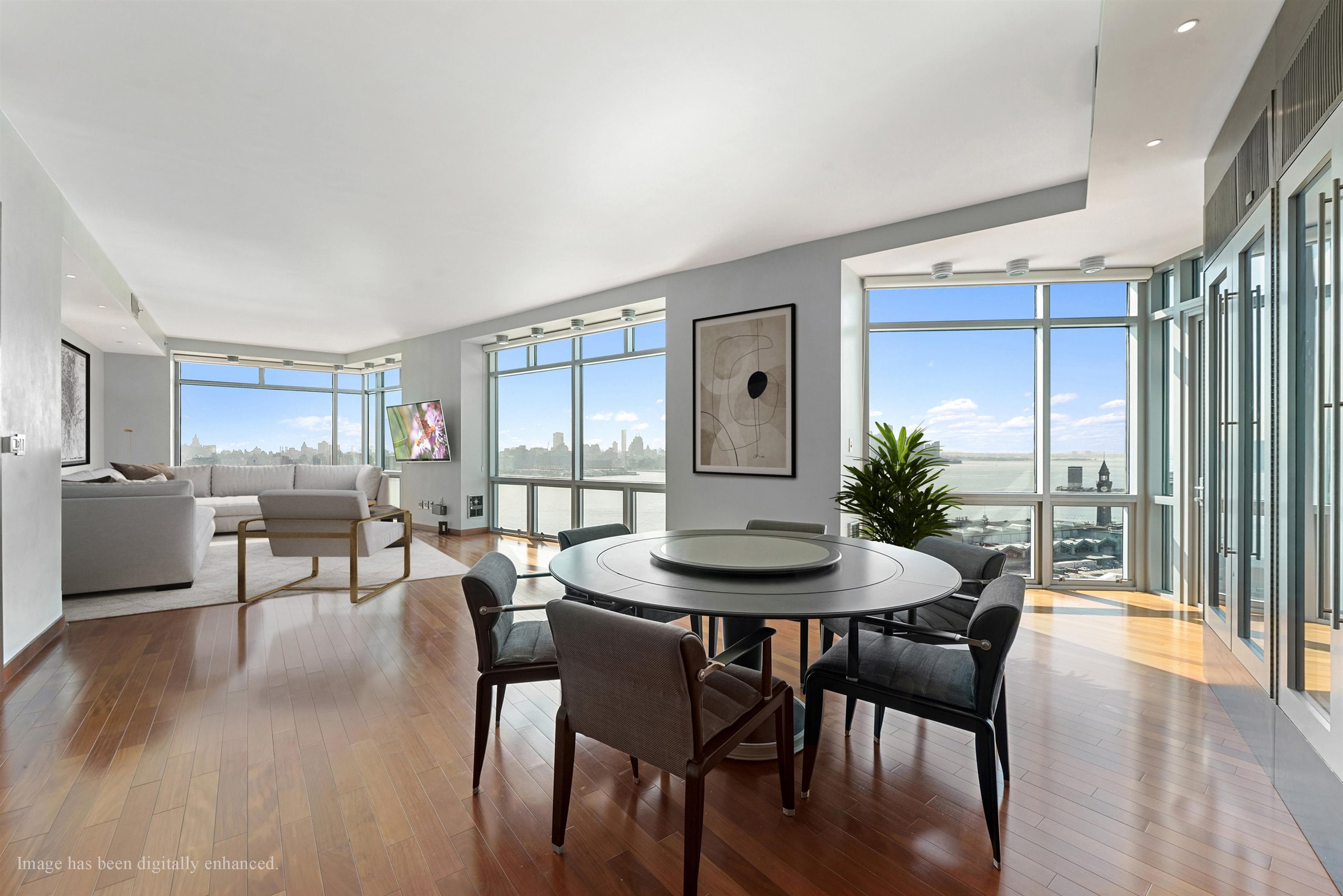 225 River Street, Unit 2003 Hoboken, NJ 07030 - Photo 7 of 19 a dining room with furniture window and wooden floor