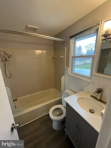 a bathroom with a sink toilet tub and shower