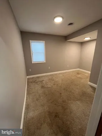 a view of a kitchen with refrigerator and microwave