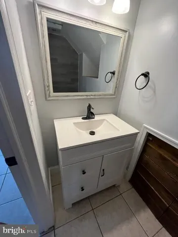 a bathroom with a sink toilet and tub