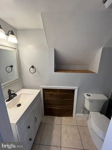 a utility room with sink dryer and washer