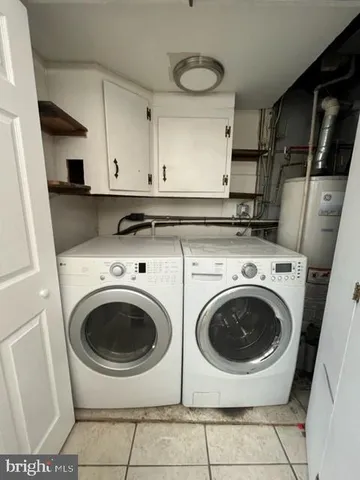a kitchen with stainless steel appliances kitchen island granite countertop a sink and cabinets