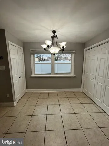a large kitchen with cabinets and stainless steel appliances