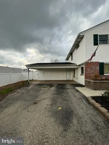 a view of a house with a street