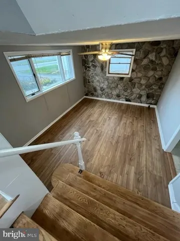 a view of entryway with wooden floor