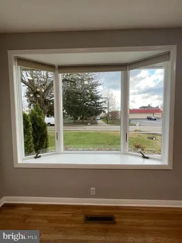 a view of a room that has a floor to ceiling window and a big room