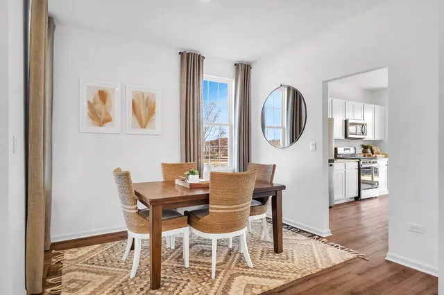 a dining room with furniture and window