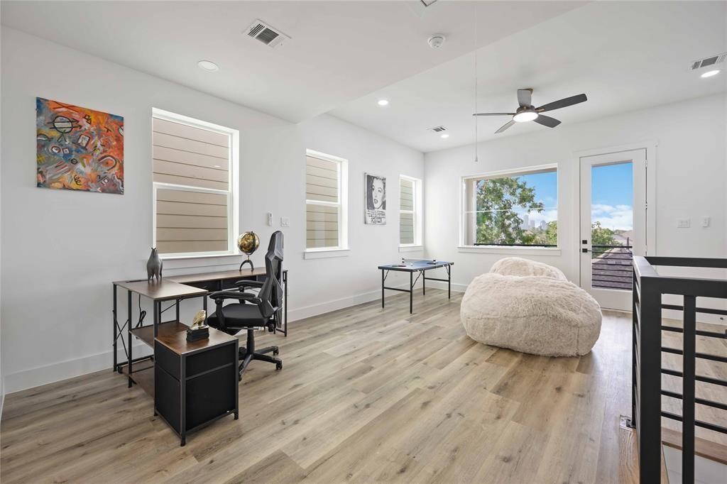 1805 Emir Street, Unit D Houston, TX 77009 - Photo 26 of 36 a living room with furniture and wooden floor