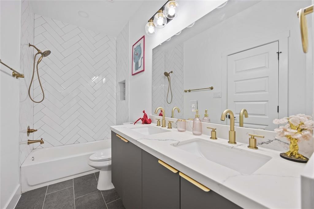 1805 Emir Street, Unit D Houston, TX 77009 - Photo 31 of 36 a bathroom with a sink vanity granite toilet tub and shower