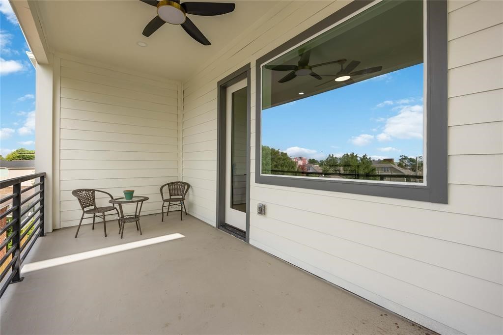 1805 Emir Street, Unit D Houston, TX 77009 - Photo 32 of 36 a view of a porch with furniture and a yard