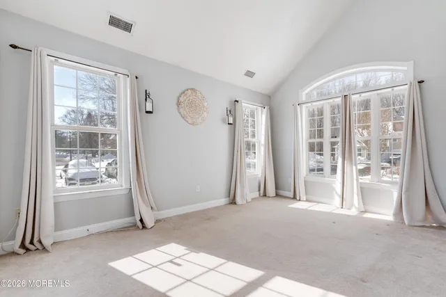 a view of a room with large windows