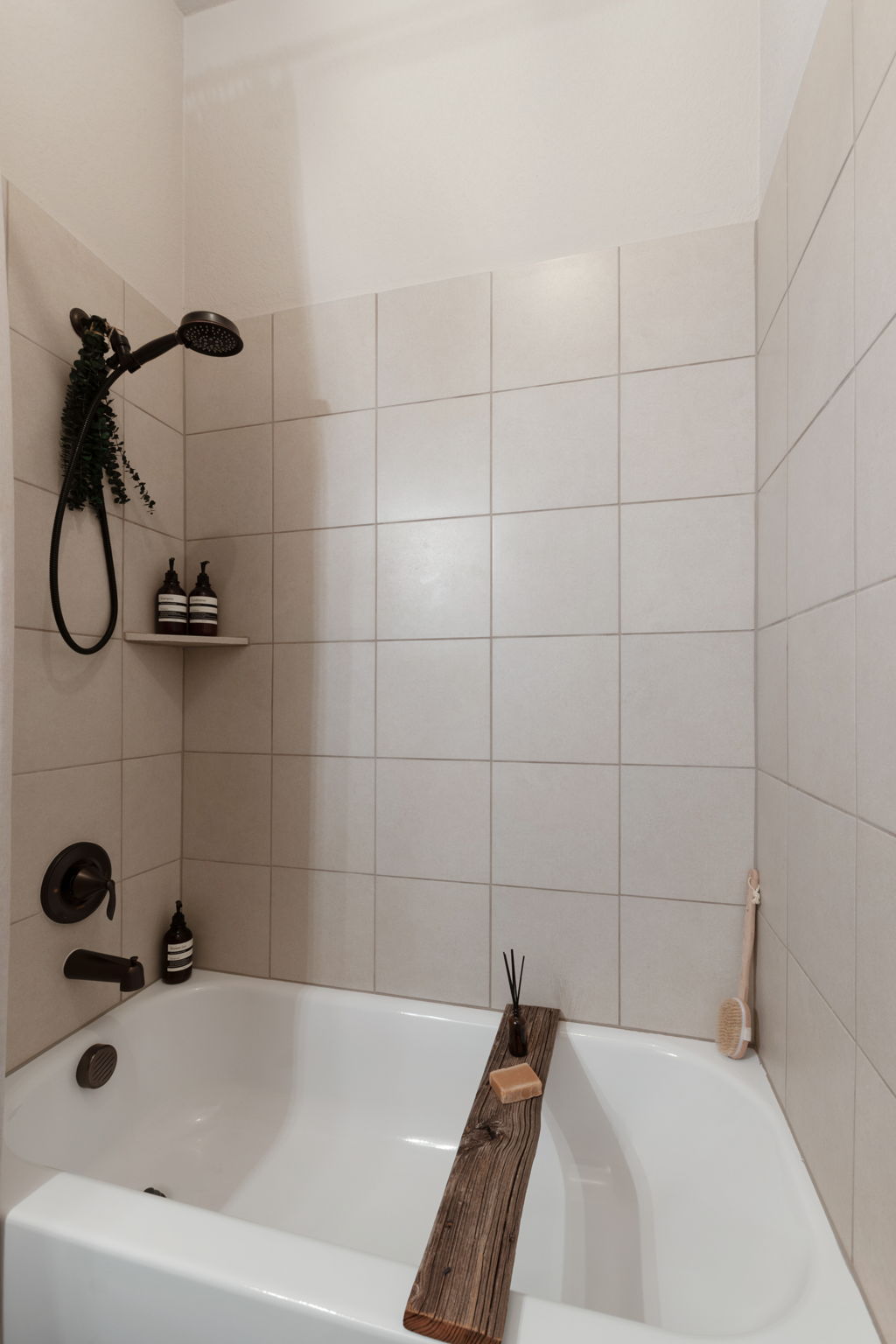 155 Balcones Ridge Way Bertram, TX 78605 - Photo 33 of 37 The soaking tub with tiled walls creates a tranquil bathing sanctuary.