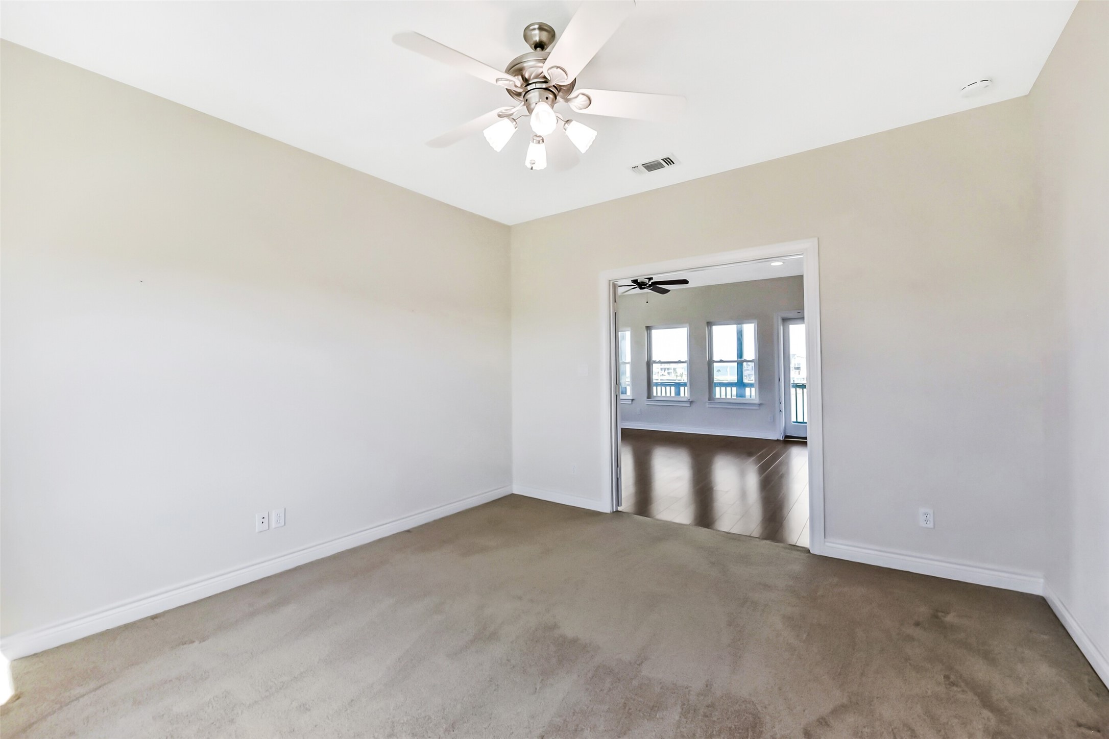 1 Loggerhead Hitchcock, TX 77563 - Photo 28 of 50 an empty room with chandelier fan and windows