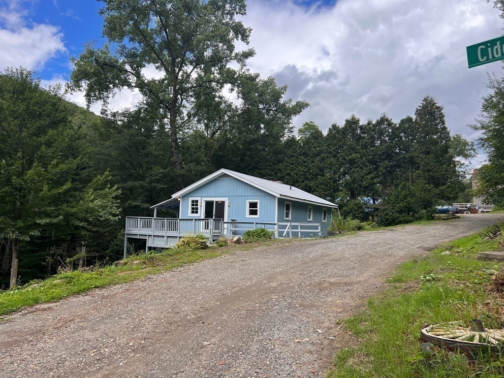 2 Cider Mill Lane Colrain, MA 01340 - Photo 11 of 32 a view of a house with a yard and large trees