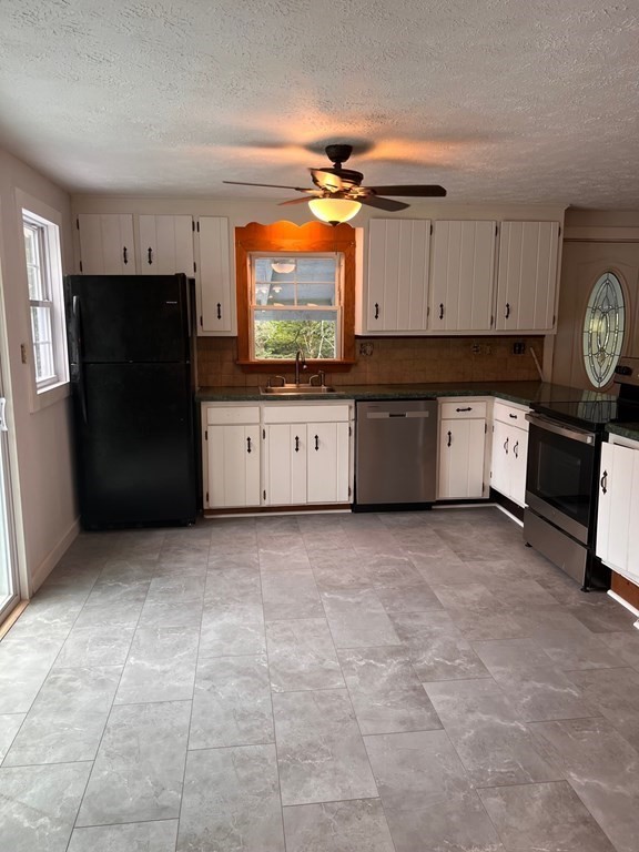 2 Cider Mill Lane Colrain, MA 01340 - Photo 13 of 32 a large kitchen with a stove refrigerator and cabinets