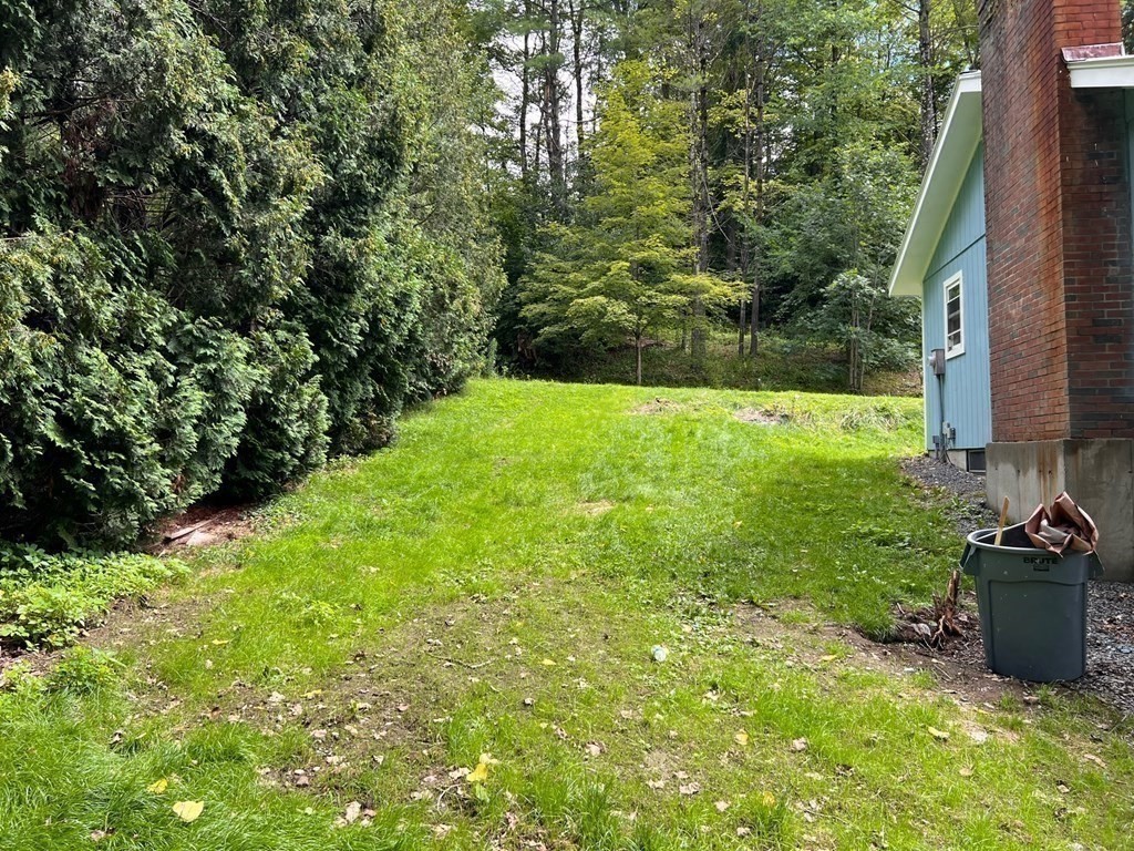 2 Cider Mill Lane Colrain, MA 01340 - Photo 23 of 32 a view of a backyard with potted plants and large trees
