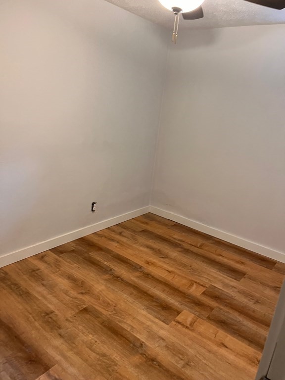 2 Cider Mill Lane Colrain, MA 01340 - Photo 29 of 32 a view of a room with wooden floor and empty racks